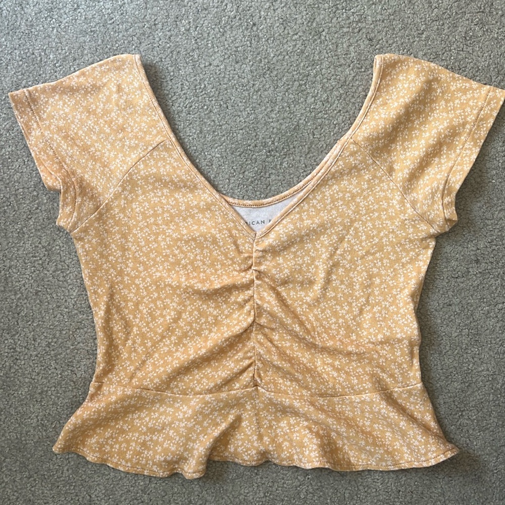 American Eagle Yellow baby tee